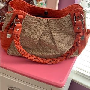 It is new with tag cute orange hand bag